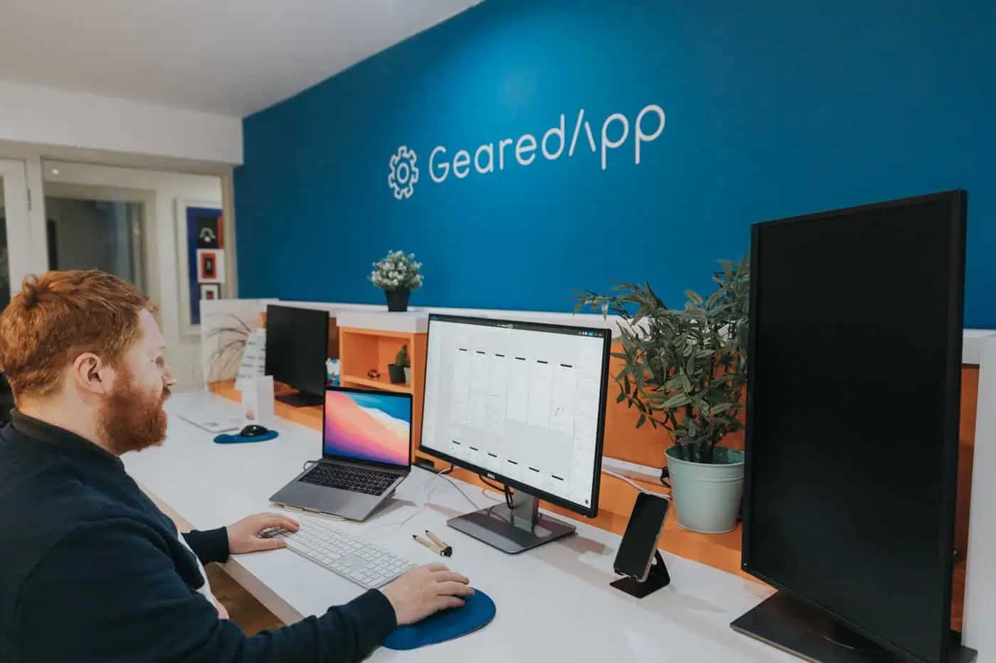 A GearedApp engineer working at their desk in our Edinburgh studio
