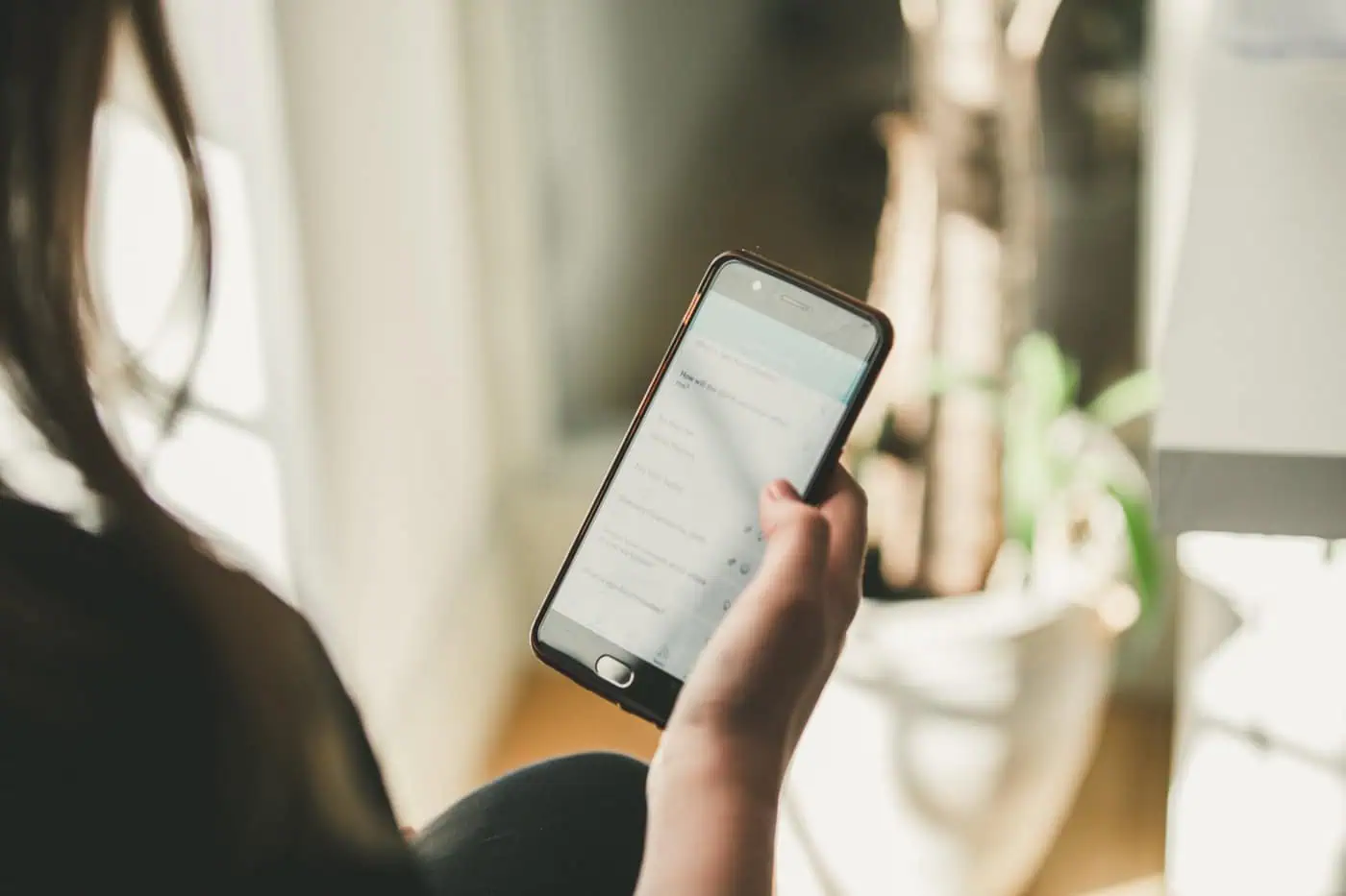 A person using a bespoke mobile product on their phone